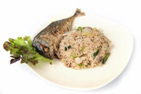 Fried rice with fried mackerel. Stock Photos