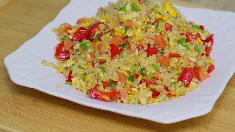 Fried rice made with red bell peppers, eggs, and sausages Stock Footage 318964067