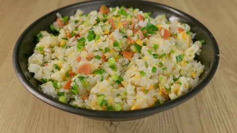 Fried rice mixed with egg, ham sausage and green onions. Stock Footage 340325751