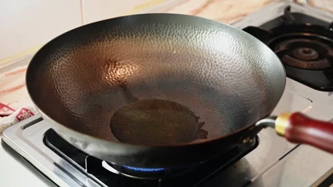 Fried Rice Stir Fried in a Black Iron Wok with High Heat Stock Footage 345341426