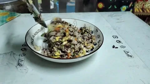 Fried rice when it comes down from the pan to the plate. Stock Footage 226288080