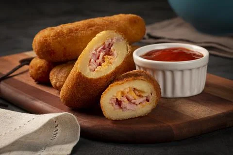 Fried risoles or Risol. Risoles stuffed with cheese and ham. Stock Photos