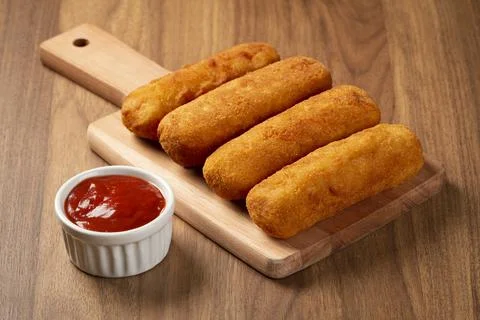 Fried risoles or Risol. Risoles stuffed with cheese and ham. Stock Photos