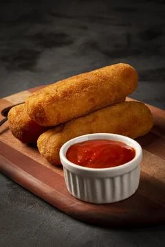Fried risoles or Risol. Risoles stuffed with cheese and ham. Stock Photos