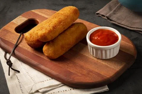 Fried risoles or Risol. Risoles stuffed with cheese and ham. Stock Photos