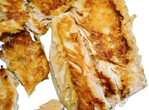 Fried salmon isolated on white background Photos