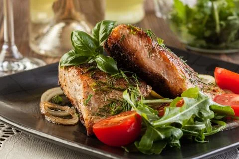 Fried salmon steak with vegetables and lemon Stock Photos