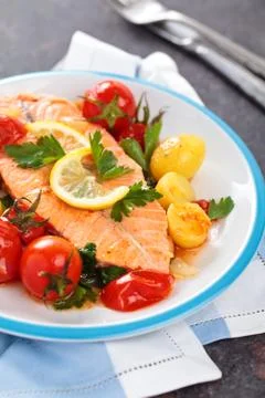 Fried salmon  with vegetables. Stock Photos
