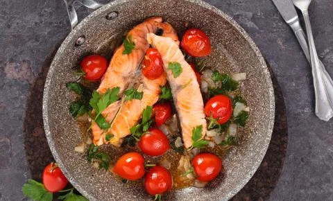 Fried salmon  with vegetables. Stock Photos