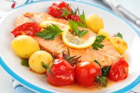 Fried salmon  with vegetables. Stock Photos