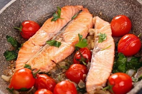 Fried salmon  with vegetables. Stock Photos