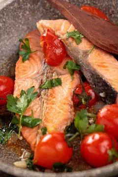 Fried salmon  with vegetables. Stock Photos