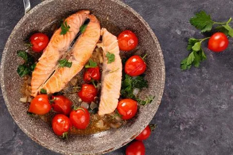 Fried salmon  with vegetables. Stock Photos