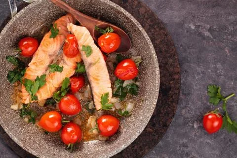 Fried salmon  with vegetables. Stock Photos