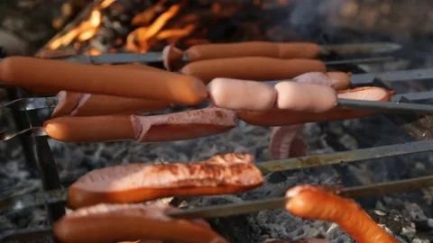 Fried sausages on the grill Stock Footage 73681038
