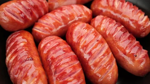 Fried sausages in pan, close up Stock Footage 237373179