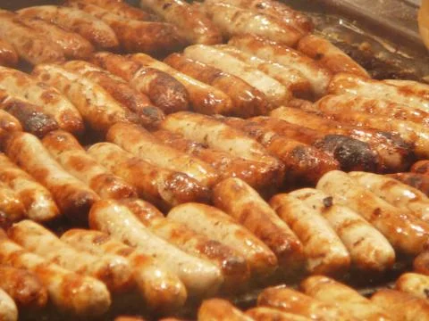 Fried sausages Stock Photos