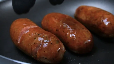 Fried sausages. The supper is ready. Grilled sausages. Slow motion. 스톡 동영상 89841953