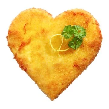 Fried schnitzel in heart shape, decorated, on white Stock Photos