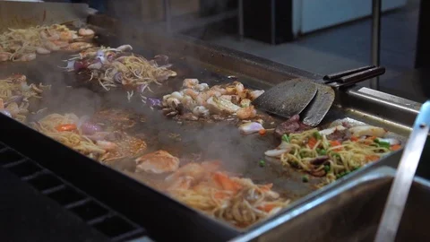 Fried seafood in large quantities in the restaurant 스톡 동영상 112090539