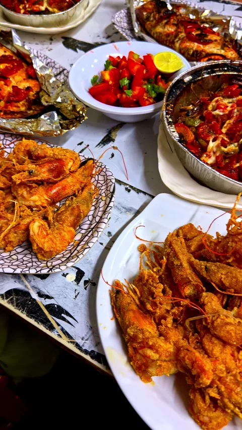 Fried Shrimp and Baked Fish Seafood Dinner on Restaurant Table Stock Footage 346585916