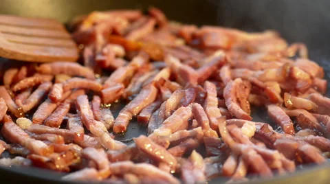 Fried sliced bacon on a hot pan Stock Footage 34281201