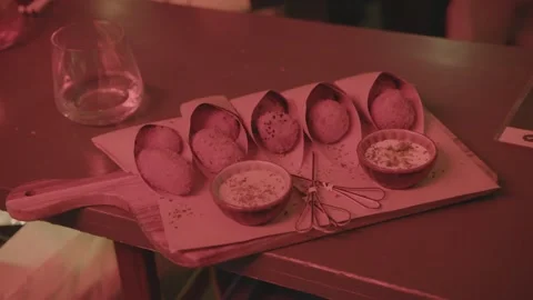 Fried Snacks and Dipping Sauces Served on Wooden Board in Beijing Bar Setting Stock Footage 345754825