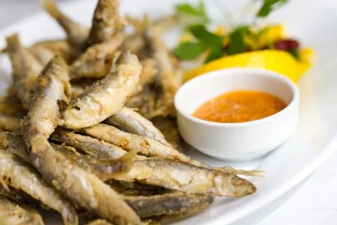 Fried sprat with souce Stock Photos