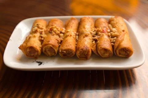 Fried spring rolls with peanut sauce Stock Photos