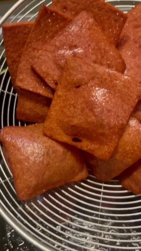 Fried Square Pastry Drained on Metal Mesh Strainer Stock Footage 345305013
