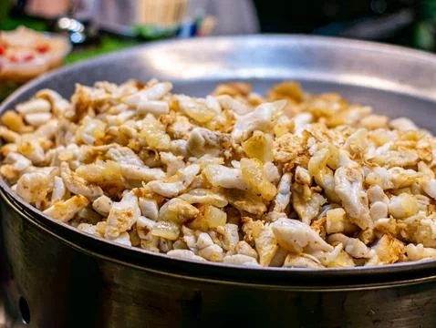 Fried Squid Eggs with Garlic Close Up in Large Pan Thai Street Food 写真素材