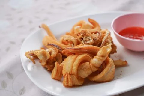 Fried squid with garlic Stock Photos