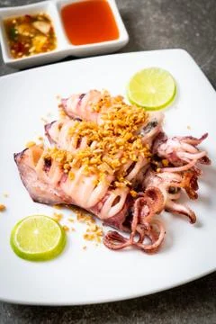 Fried squid with garlic Stock Photos