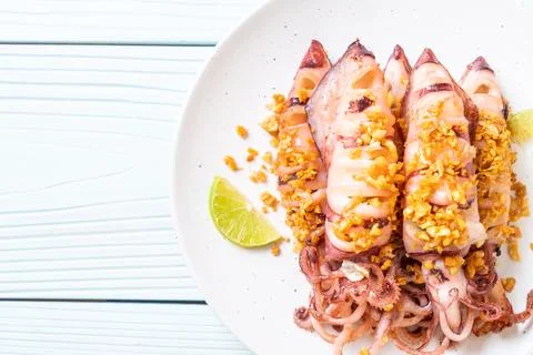 Fried squid with garlic Stock Photos