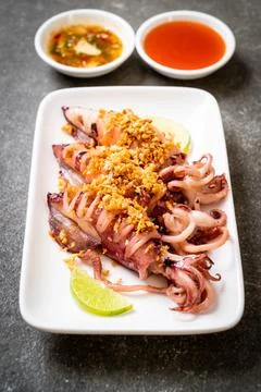 Fried squid with garlic Stock Photos