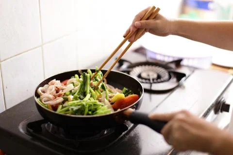 Fried squid with onion, pineapple, celery Stock Photos