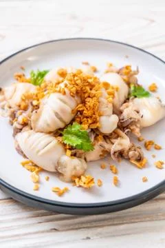Fried squid or octopus with garlic Stock Photos