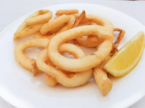 Fried squid rings Stock Photos