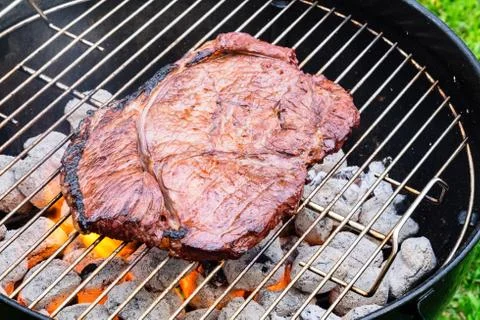 Fried Steak on a Grill Stock Photos