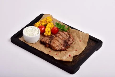 Fried steak with vegetables Stock Photos