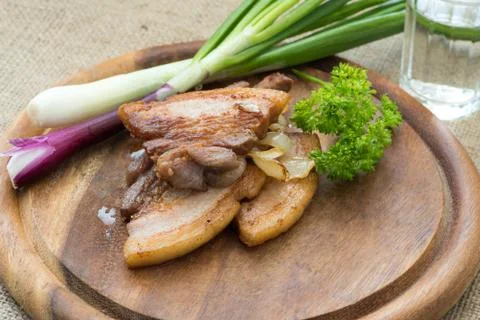 Fried streak of lean (fatback) served with vodka Stock Photos