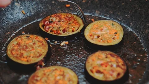 Fried stuffed eggplants with stuffing in a pan Видео 252179651