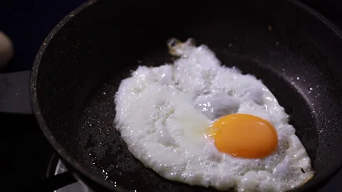 Fried Sunny Side Up Egg On A Pan Stock Footage 160140113