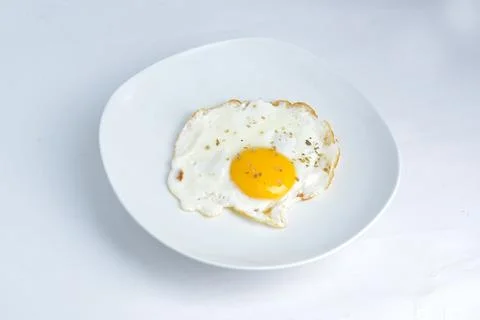 Fried sunny side up egg Stock Photos