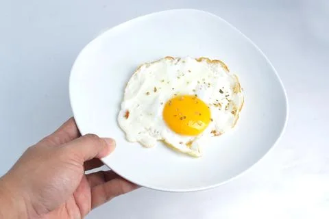 Fried sunny side up egg Stock Photos