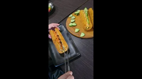 Fried sushi roll in crispy breading with shrimp and fish, cucumber and caviar Stock-Footage 344845711