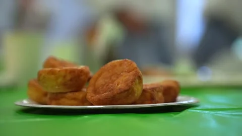 Fried sweet donuts on the table before consumption. Stock Footage 318170556