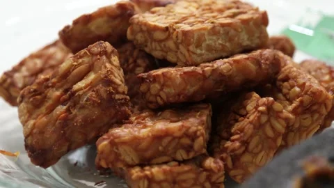 Fried tempeh in oil is served as a side dish in developing countries. Stock Footage 300853145