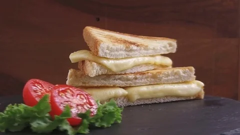 Fried toast with cheese on a stone surface rotate Stock Footage 79620039