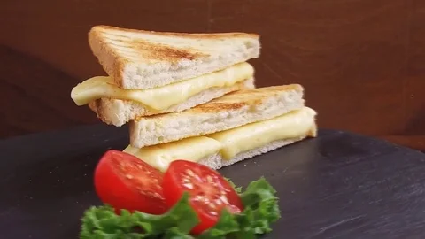 Fried toast with cheese on a stone surface rotate Stock Footage 79640281